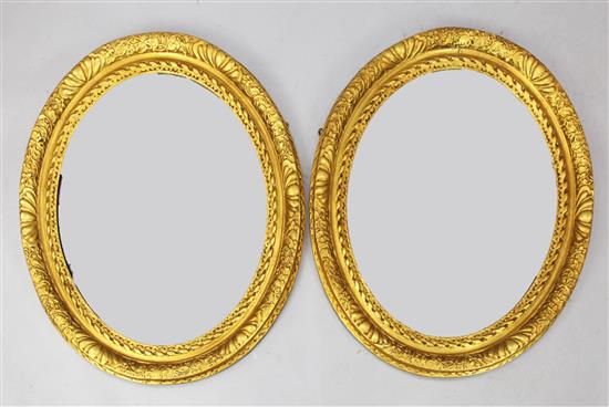 Pair of oval gilt frame wall mirrors(-)
